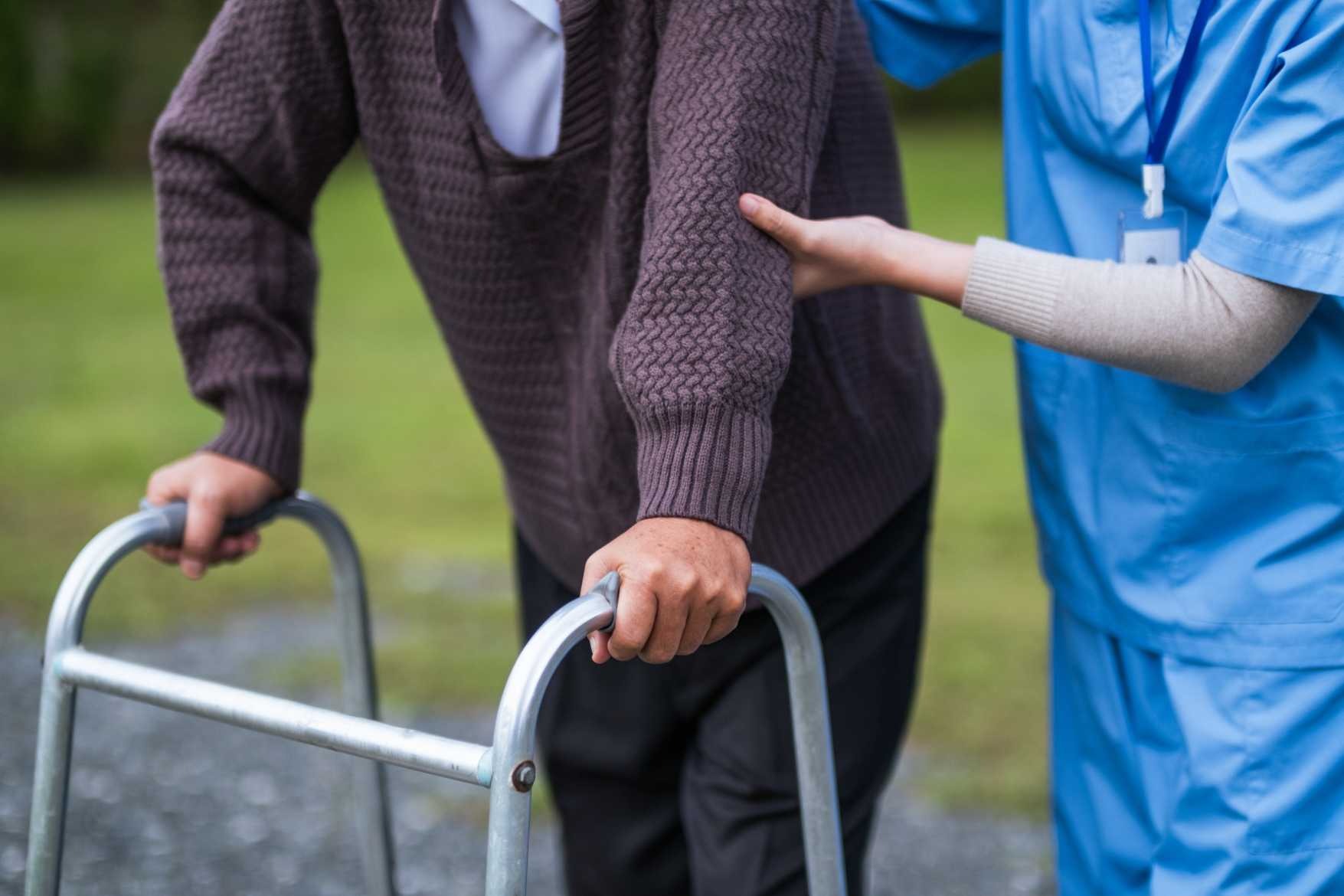 Elderly person using a mobility aid safely at home